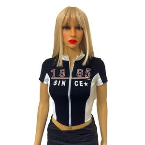 Black and white zip up 1985 short sleeve mock neck blouse.